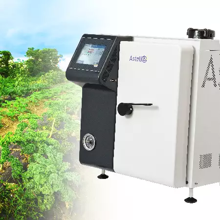An Astell Benchtop autoclave near rows of food crops