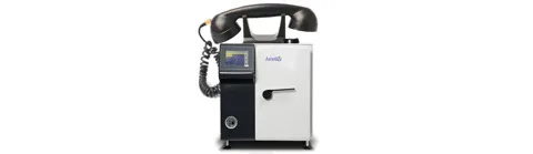 An Astell benchtop autoclave with a rotary telephone receiver on top, symbolizing Astell's telephone support.